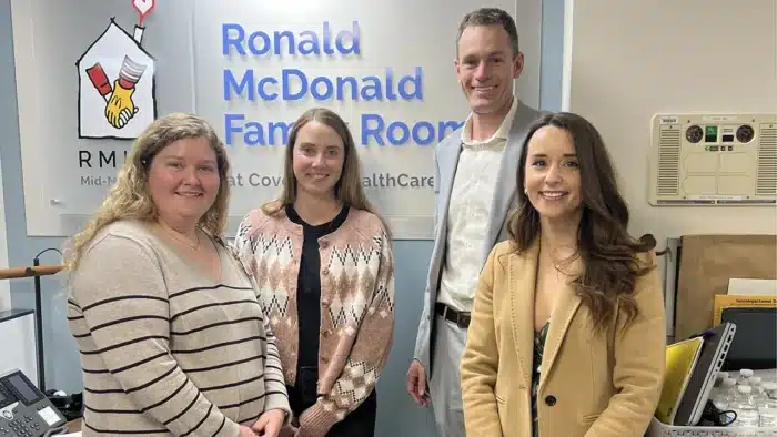 DKR Marketing team participating in community engagement at Ronald McDonald Family Room, highlighting human connection in modern marketing